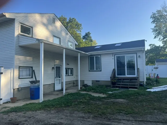 Before construction — original rear of home
