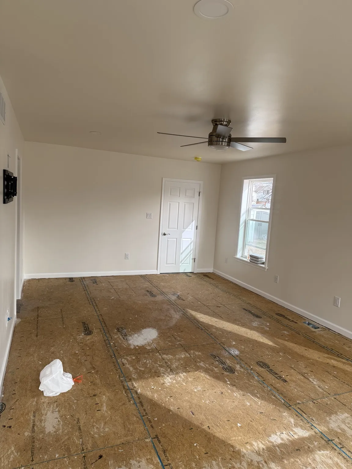 Finished walls, lighting, and ceiling fan