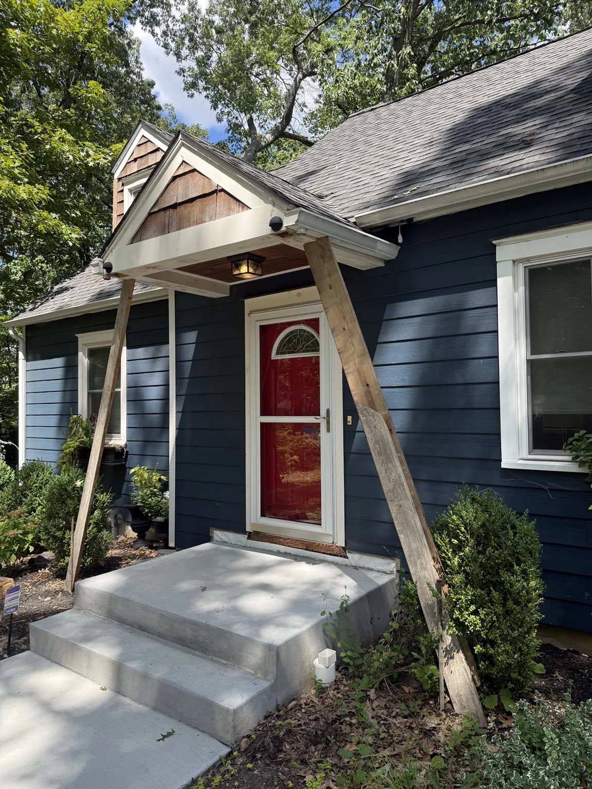 Front portico under construction with temporary wood supports